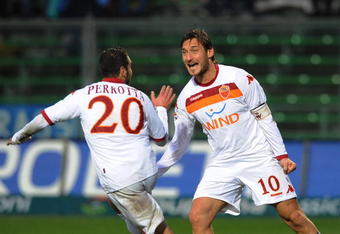 BERGAMO, ITALY - NOVEMBER 29:  Simone Perrotta of Roma celebrates after scoring their second Roma's goal with Francesco Totti during the Serie A match between Atalanta and Roma at Stadio Atleti Azzurri d'Italia on November 29, 2009 in Bergamo, Italy.  (Photo by Dino Panato/Getty Images)