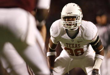COLLEGE STATION, TX - NOVEMBER 26: Linebacker Roddrick Muckelroy #38 of the Texas Longhorns zeroes in against quarterback Jerrod Johnson #1 of the Texas A&M Aggies in the first half at Kyle Field on November 26, 2009 in College Station, Texas. The Longhorns defeated the Aggies 49-39. (Photo by Aaron M. Sprecher/Getty Images)