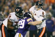 MINNEAPOLIS - NOVEMBER 29:  Jay Cutler #6 of the Chicago Bears is pressured by Heath Farwell #59 of the Minnesota Vikings on November 29, 2009 at Hubert H. Humphrey Metrodome in Minneapolis, Minnesota.  (Photo by Elsa/Getty Images)