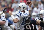HOUSTON - NOVEMBER 29: Quarterback Peyton Manning #18 of the Indianapolis Colts passes in traffic down-field in the third quarter against the Houston Texans at Reliant Stadium on November 29, 2009 in Houston, Texas. (Photo by Bob Levey/Getty Images)