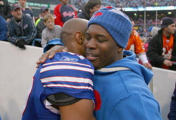 ORCHARD PARK, NY - NOVEMBER 29:  George Wilson #37 and Perry Fewell, head coach of the Buffalo Bills embrace after defeating the Miami Dolphins at Ralph Wilson Stadium on November 29, 2009 in Orchard Park, New York. Buffalo won 31-14. (Photo by Rick Stewart/Getty Images)