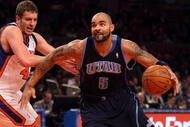 NEW YORK - NOVEMBER 09: Carlos Boozer #5 of the Utah Jazz drives to the basket past David Lee #42 of the New York Knicks at Madison Square Garden on November 9, 2009 in New York City.  NOTE TO USER: User expressly acknowledges and agrees that, by downloading and/or using this Photograph, User is consenting to the terms and conditions of the Getty Images License Agreement.  (Photo by Nick Laham/Getty Images)