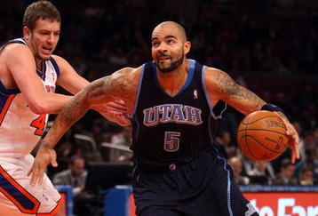 NEW YORK - NOVEMBER 09: Carlos Boozer #5 of the Utah Jazz drives to the basket past David Lee #42 of the New York Knicks at Madison Square Garden on November 9, 2009 in New York City.  NOTE TO USER: User expressly acknowledges and agrees that, by downloading and/or using this Photograph, User is consenting to the terms and conditions of the Getty Images License Agreement.  (Photo by Nick Laham/Getty Images)