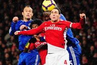 LONDON, ENGLAND - NOVEMBER 29: Cesc Fábregas of Arsenal defends a ball during the Barclays Premier League match between Arsenal and Chelsea at the Emirates Stadium on November 29, 2009 in London, England. (Photo by Mike Hewitt/Getty Images)
