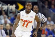 KANSAS CITY, MO - NOVEMBER 24: Erving Walker #11 of the Florida Gators drives the ball downcourt against the Syracuse Orange during the CBE Classic game on November 24, 2008 at the Sprint Center in Kansas City, Missouri. (Photo by Jamie Squire/Getty Images)