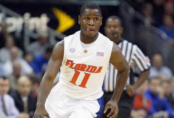 KANSAS CITY, MO - NOVEMBER 24: Erving Walker #11 of the Florida Gators drives the ball downcourt against the Syracuse Orange during the CBE Classic game on November 24, 2008 at the Sprint Center in Kansas City, Missouri. (Photo by Jamie Squire/Getty Images)