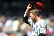 NEW YORK - JULY 04:  Roy Halladay #32 of the Toronto Blue Jays removes his hat against the New York Yankees on July 4, 2009 at Yankee Stadium in the Bronx borough of New York City.  (Photo by Nick Laham/Getty Images)