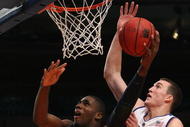 NEW YORK - NOVEMBER 27:  Alex Oriakhi #34 of the Connecticut Huskies shoots the ball against Miles Plumlee #21 of the Duke Blue Devils during the Championship game at Madison Square Garden on November 27, 2009 in New York, New York.  (Photo by Nick Laham/Getty Images)