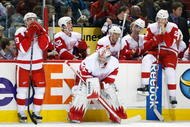 MONTREAL- NOVEMBER 21:  Jimmy Howard #35 of the Detroit Red Wings waits with team mates Pavel Datsyuk #13 and Brad Stuart #23 for the shootout round to begin during the NHL game against the Montreal Canadiens on November 21, 2009 at the Bell Centre in Montreal, Quebec, Canada.  The Red Wings defeated the Canadiens 3-2 in a shootout.  (Photo by Richard Wolowicz/Getty Images)
