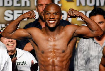 LAS VEGAS - SEPTEMBER 18:  Boxer Floyd Mayweather Jr. poses during the official weigh-in for his fight against Juan Manuel Marquez at the MGM Grand Garden Arena September 18, 2009 in Las Vegas, Nevada. The two will fight at the MGM on September 19.  (Photo by Ethan Miller/Getty Images)