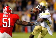 ATLANTA - NOVEMBER 28: Akeem Dent #51 of the Georgia Bulldogs tackles quarterback Josh Nesbitt #9 of the Georgia Tech Yellow Jackets at Bobby Dodd Stadium on November 28, 2009 in Atlanta, Georgia. (Photo by Kevin C. Cox/Getty Images)