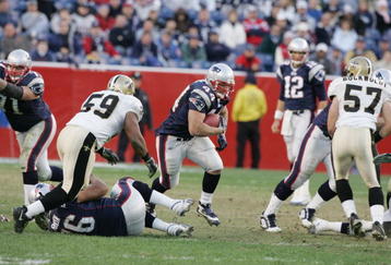 FOXBOROUGH, MA - NOVEMBER 20:  Fullback Heath Evans #44 of the New England Patriots carries the ball against linebacker Ronald McKinnon #59 of the New Orleans Saints at Gillette Stadium on November 20, 2005 in Foxborough, Massachusetts.The Patriots defeated the Saints 24-17. (Photo by Jim McIsaac/Getty Images)    