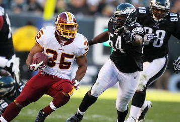 PHILADELPHIA - NOVEMBER 29:  Quinton Ganther #35 of the Washington Redskins runs with the ball as Jeremiah Trotter #54 of the Philadelphia Eagles chases during their game at Lincoln Financial Field on November 29, 2009 in Philadelphia, Pennsylvania.  (Photo by Al Bello/Getty Images)