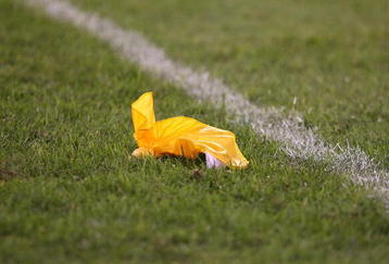CHICAGO - AUGUST 22: A referees' penalty flag lies on the field during a pre-season game between the Chicago Bears and the New York Giants on August 22, 2009 at Soldier Field in Chicago, Illinois. The Bears defeated the Giants 17-3. (Photo by Jonathan Daniel/Getty Images)