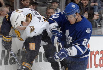 TORONTO - MARCH 3: Henrik Tallinder #10 of the Buffalo Sabres and Alexei Ponikarovsky #23 of the Toronto Maple Leafs battle for the puck during the NHL game at Air Canada Centre March 3, 2007 in Toronto, Ontario, Canada. (Photo by Dave Abel/Getty Images)