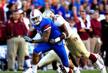 GAINESVILLE, FL - NOVEMBER 28:  Aaron Hernandez #81 of the Florida Gators runs after making a reception against Dekoda Wason #36 of the Florida State Seminoles at Ben Hill Griffin Stadium on November 28, 2009 in Gainesville, Florida.  (Photo by Sam Greenwood/Getty Images)