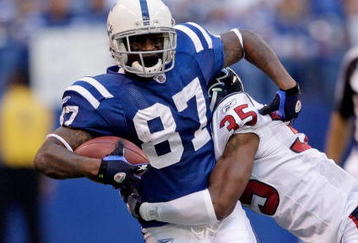 INDIANAPOLIS - NOVEMBER 8:  Reggie Wayne #87 of the Indianapolis Colts runs with the ball during the NFL game against the Houston Texans at Lucas Oil Stadium on November 8, 2009 in Indianapolis, Indiana.  The Colts defeated the Texans 20-17.  (Photo by Andy Lyons/Getty Images)