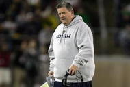 PALO ALTO, CA - NOVEMBER 28:  Notre Dame head coach Charlie Weis walks back to the sideline after speaking to his team during their game against the Stanford Cardinal at Stanford Stadium on November 28, 2009 in Palo Alto, California.  (Photo by Ezra Shaw/Getty Images)