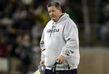 PALO ALTO, CA - NOVEMBER 28:  Notre Dame head coach Charlie Weis walks back to the sideline after speaking to his team during their game against the Stanford Cardinal at Stanford Stadium on November 28, 2009 in Palo Alto, California.  (Photo by Ezra Shaw/Getty Images)