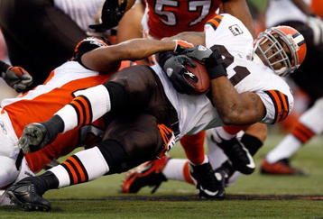 CINCINNATI - NOVEMBER 29:  Jamal Lewis #31 of the Cleveland Browns is tackled by Chris Crocker #42 of the Cincinnati Bengals during the NFL game at Paul Brown Stadium on November 29, 2009 in Cincinnati, Ohio.  (Photo by Andy Lyons/Getty Images)