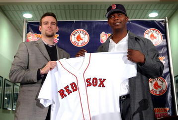 BOSTON - DECEMBER 17:  Newly acquired shortstop Edgar Renteria and Red Sox General Manager Theo Epstein hold up Renteria's jersey December 17, 2004 at Fenway Park in Boston, Massachusetts. The Red Sox signed Renteria to a four-year contract with a club option for the 2009 season.  (Photo by Darren McCollester/Getty Images)
