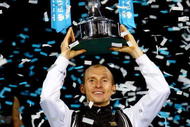 LONDON, ENGLAND - NOVEMBER 29:  Nikolay Davydenko of Russia holds the trophy as he celebrates winning the men's singles final match against Juan Martin Del Potro of Argentina during the Barclays ATP World Tour Finals at the O2 Arena on November 29, 2009 in London, England.  (Photo by Julian Finney/Getty Images)