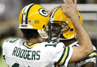DETROIT , MI - NOVEMBER 26: Donald Lee #86 of the Green Bay Packers celebrates a first second quarter touchdown with Aaron Rodgers #12 while playing the Detroit Lions on November 26, 2009 at Ford Field in Detroit, Michigan.  (Photo by Gregory Shamus/Getty Images)