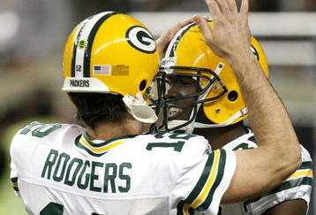 DETROIT , MI - NOVEMBER 26: Donald Lee #86 of the Green Bay Packers celebrates a first second quarter touchdown with Aaron Rodgers #12 while playing the Detroit Lions on November 26, 2009 at Ford Field in Detroit, Michigan.  (Photo by Gregory Shamus/Getty Images)