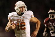 COLLEGE STATION, TX - NOVEMBER 26: Quarterback Colt McCoy #12 of the Texas Longhorns looks back as he scrambles away from the Texas A&M Aggies to score a touchdown in the first half at Kyle Field on November 26, 2009 in College Station, Texas.  (Photo by Aaron M. Sprecher/Getty Images)