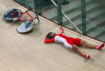 PRUSZKOW, POLAND - MARCH 25:  Edyta Jasinska of Poland on the floor after crashing during the Women's Individual pursuit qualifying during the UCI Track Cycling World Championships at the BGZ Arena on March 25, 2009 in Pruszkow, Poland.  (Photo by Clive Rose/Getty Images)