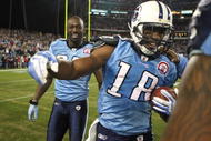 NASHVILLE, TN - NOVEMBER 29:  Kenny Britt #18 of the Tennessee Titans celebrates with teammate Jevon Kearse #90 after catching the game-winning touchdown to give the Titans a 20-17 victory over the Arizona Cardinals during their game at LP Field on November 29, 2009 in Nashville, Tennessee.  (Photo by Streeter Lecka/Getty Images)