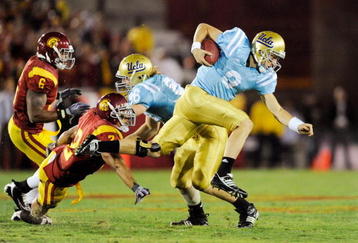 LOS ANGELES, CA - NOVEMBER 28:  Kevin Craft #3 of the UCLA Bruins scarmbles for yardage agaunst USC Trojans during the thrid quarter of the NCAA college football game at Los Angeles Memorial Coliseum on November 28, 2009 in Los Angeles, California. Trojans won, 28-7.  (Photo by Kevork Djansezian/Getty Images)