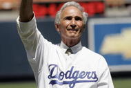 LOS ANGELES - AUGUST 28: Hall of Fame pitcher Sandy Koufax of the Los Angeles Dodgers waves to the crowd during ceremonies honoring memebers of the 1955 World Champion Dodgers before the game with the Houston Astros on August 28, 2005 at Dodger Stadium in Los Angeles, California. The Dodgers won 1-0. (Photo by Stephen Dunn /Getty Images)
