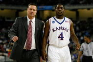 DETROIT - MARCH 28:  Head coach Bill Self and Sherron Collins #4 of the Kansas Jayhawks walk towards the bench against the Villanova Wildcats during the Midwest Regional Semifinal of the 2008 NCAA Division I Men's Basketball Tournament at Ford Field on March 28, 2008 in Detroit, Michigan  (Photo by Gregory Shamus/Getty Images)