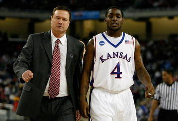 DETROIT - MARCH 28:  Head coach Bill Self and Sherron Collins #4 of the Kansas Jayhawks walk towards the bench against the Villanova Wildcats during the Midwest Regional Semifinal of the 2008 NCAA Division I Men's Basketball Tournament at Ford Field on March 28, 2008 in Detroit, Michigan  (Photo by Gregory Shamus/Getty Images)