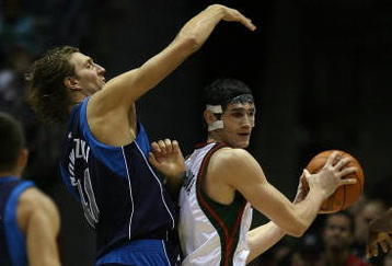 MILWAUKEE - NOVEMBER 16: Ersan Ilyasova #7 of the Milwuakee Bucks looks to pass under pressure from Dirk Nowitzki #41 of the Dallas Mavericks at the Bradley Center on November 16, 2009 in Milwaukee, Wisconsin. The Mavericks defeated the Bucks 115-113 in overtime. (Photo by Jonathan Daniel/Getty Images)