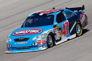FORT WORTH, TX - NOVEMBER 06:  Marcos Ambrose drives the #47 Little Debbie/Kingsford/Clorox Toyota during practice for the NASCAR Sprint Cup Series Dickies 500 at Texas Motor Speedway on November 6, 2009 in Fort Worth, Texas.  (Photo by Geoff Burke/Getty Images for NASCAR)