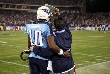 NASHVILLE, TN - NOVEMBER 29:  Vince Young #10 and head coach Jeff Fisher of the Tennessee Titans share a moment during their game against the Arizona Cardinals at LP Field on November 29, 2009 in Nashville, Tennessee.  (Photo by Streeter Lecka/Getty Images)