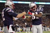 FOXBORO, MA - NOVEMBER 22:  Randy Moss #81 and Tom Brady #12 of the New England Patriots celebrate Laurence Maroney's touchdown in the second quarter against the New York Jets on November 22, 2009 at Gillette Stadium in Foxboro, Massachusetts.  (Photo by Elsa/Getty Images)
