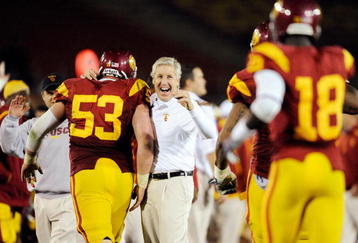 LOS ANGELES, CA - NOVEMBER 28:  Pete Carroll (C) of the USC Trojans celebrates with Jeff Byers #53 after Damian Williams #18 wide receiver of the USC Trojans scored a 48-yard touchdown pass after UCLA Bruins called a time out with one minute remaining in the NCAA college football game at Los Angeles Memorial Coliseum on November 28, 2009 in Los Angeles, California.  (Photo by Kevork Djansezian/Getty Images)