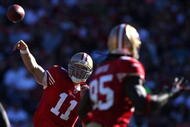 SAN FRANCISCO - NOVEMBER 29: Alex Smith #11 of the San Francisco 49ers passes to Vernon Davis #85 of the Jacksonville Jaguars during an NFL game at Candlestick Park on November 29, 2009 in San Francisco, California.  (Photo by Jed Jacobsohn/Getty Images)