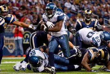 ST. LOUIS - NOVEMBER 29:  Justin Forsett #20 of the Seattle Seahawks scores a touchdown against the St. Louis Rams at the Edward Jones Dome on November 29, 2009 in St. Louis, Missouri.  The Seahawks beat the Rams 27-17.  (Photo by Dilip Vishwanat/Getty Images)