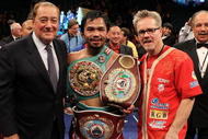 LAS VEGAS - NOVEMBER 14:  (L-R) Promoter Bob Arum, boxer Manny Pacquiao and trainer Freddie Roach celebrate Pacquiao's 12 round TKO victory against Miguel Cotto during their WBO welterweight title fight at the MGM Grand Garden Arena on November 14, 2009 in Las Vegas, Nevada.  (Photo by Al Bello/Getty Images)