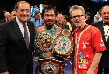 LAS VEGAS - NOVEMBER 14:  (L-R) Promoter Bob Arum, boxer Manny Pacquiao and trainer Freddie Roach celebrate Pacquiao's 12 round TKO victory against Miguel Cotto during their WBO welterweight title fight at the MGM Grand Garden Arena on November 14, 2009 in Las Vegas, Nevada.  (Photo by Al Bello/Getty Images)