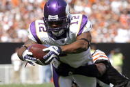 CLEVELAND - SEPTEMBER 13:  Percy Harvin #12 of the Minnesota Vikings dives for a touchdown as he is hit Brodney Pool #21 of the Cleveland Browns at Cleveland Browns Stadium on September 13, 2009 in Cleveland, Ohio.  (Photo by Matt Sullivan/Getty Images)