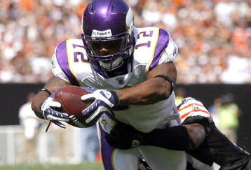 CLEVELAND - SEPTEMBER 13:  Percy Harvin #12 of the Minnesota Vikings dives for a touchdown as he is hit Brodney Pool #21 of the Cleveland Browns at Cleveland Browns Stadium on September 13, 2009 in Cleveland, Ohio.  (Photo by Matt Sullivan/Getty Images)