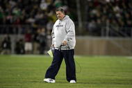 PALO ALTO, CA - NOVEMBER 28:  Notre Dame head coach Charlie Weis walks back to the sideline after speaking to his team during their game against the Stanford Cardinal at Stanford Stadium on November 28, 2009 in Palo Alto, California.  (Photo by Ezra Shaw/Getty Images)