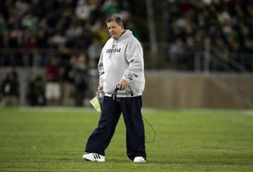 PALO ALTO, CA - NOVEMBER 28:  Notre Dame head coach Charlie Weis walks back to the sideline after speaking to his team during their game against the Stanford Cardinal at Stanford Stadium on November 28, 2009 in Palo Alto, California.  (Photo by Ezra Shaw/Getty Images)