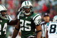 EAST RUTHERFORD, NJ - NOVEMBER 29:  Kerry Rhodes #25 of the New York Jets celebrates his second interception of the game against the Carolina Panthers with teammate Darrelle Revis #24 on November 29, 2009 at Giants Stadium in East Rutherford, New Jersey. The Jets defeated the Panthers 17-6.  (Photo by Jim McIsaac/Getty Images)