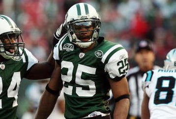 EAST RUTHERFORD, NJ - NOVEMBER 29:  Kerry Rhodes #25 of the New York Jets celebrates his second interception of the game against the Carolina Panthers with teammate Darrelle Revis #24 on November 29, 2009 at Giants Stadium in East Rutherford, New Jersey. The Jets defeated the Panthers 17-6.  (Photo by Jim McIsaac/Getty Images)